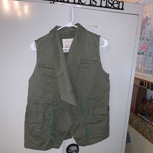 Green vest with floral design on back